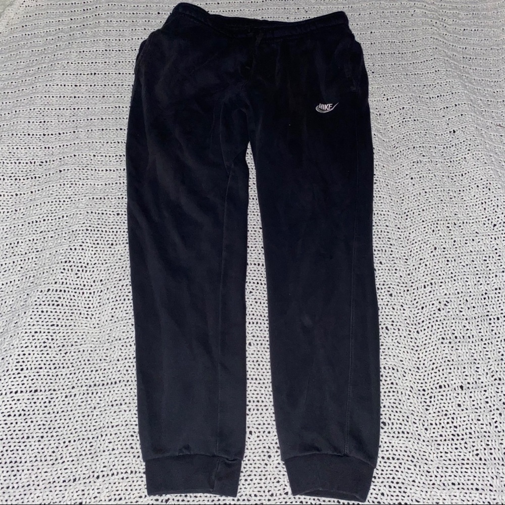 Black Nike sweatpants.